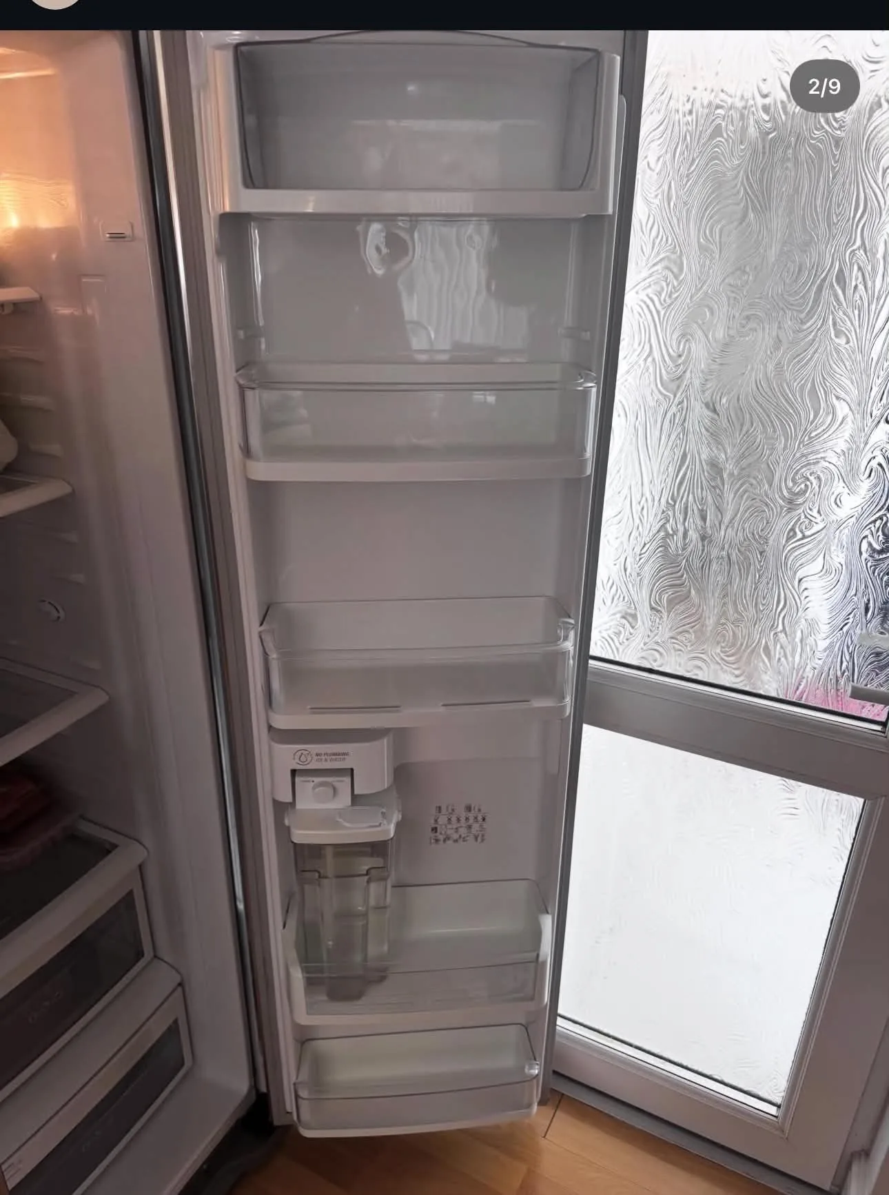 Empty fridge door storage before organisation
