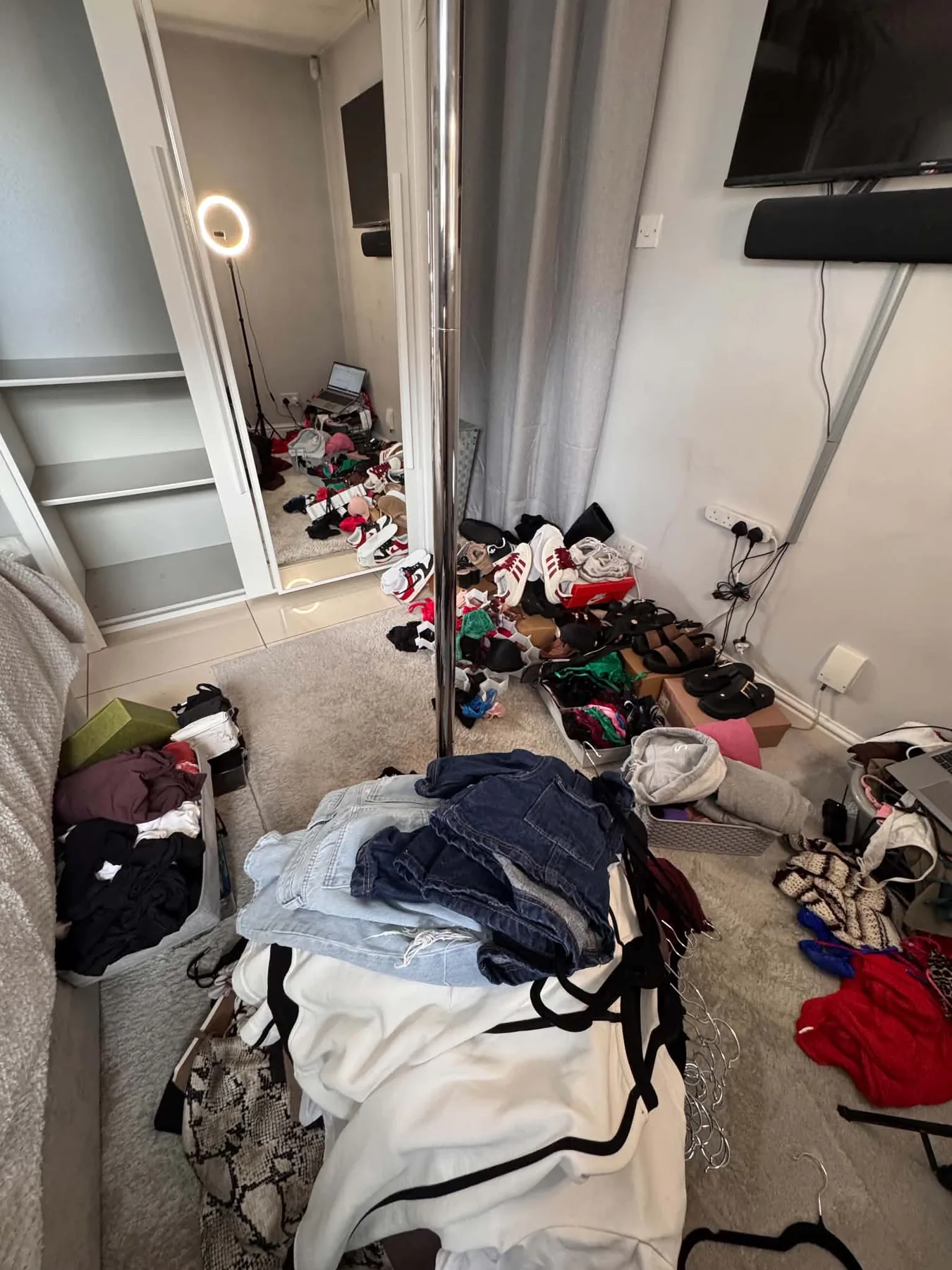 Clothes and shoes laid out during the wardrobe decluttering process